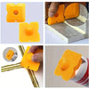 A set of yellow precision caulking tools shown in various forms and applications for sealing gaps.