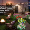 Solar LED azalea flowers in various colors decorating a garden pathway and outdoor space.