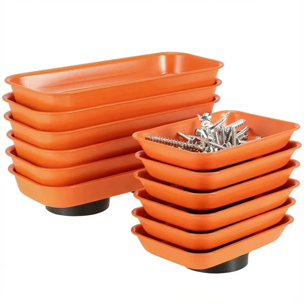 A stack of orange magnetic parts trays for screws, nuts, and bolts.