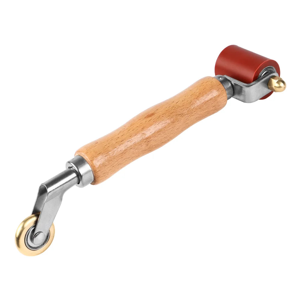 A wooden-handled seam roller tool with a silicone roller and metal components.