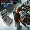 A man is using a portable trolley case tool set to work on an engine component.