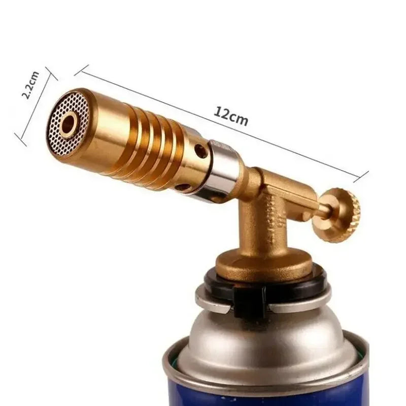 A professional gas torch with a brass nozzle and silver body is shown, highlighting its design features.