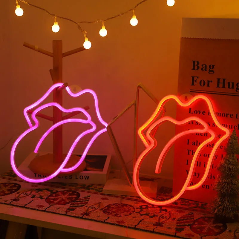 Neon heart lip light decoration glowing pink and orange on a wooden surface