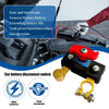 Interruptor de desconexión de batería de doble voltaje rojo y negro con conector de latón junto a un componente del motor de 