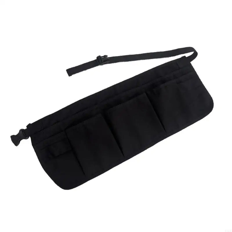 Schwarze, wasserabweisende Werkstatt-Schürze mit mehreren Taschen und Tragegurt für DIY und Gartenarbeit.