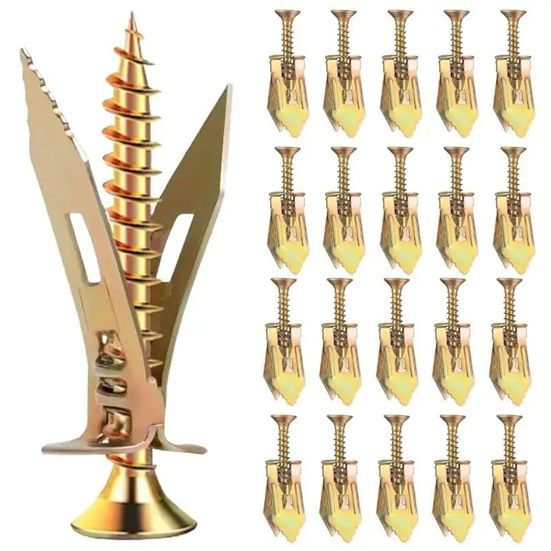 A set of self-tapping drywall expansion anchors in a brass or gold finish.