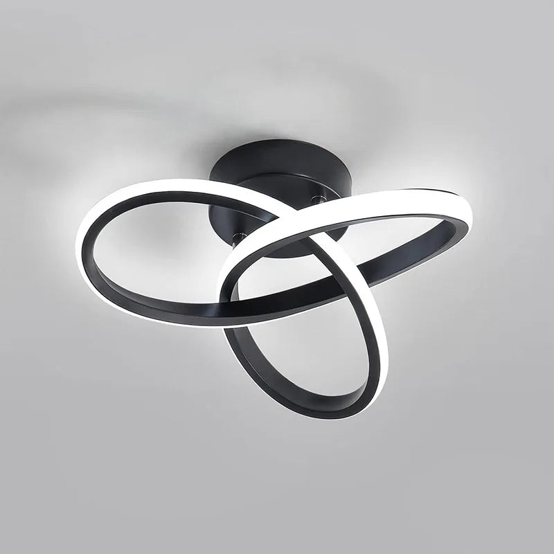 A modern black and white infinity design LED ceiling light fixture.
