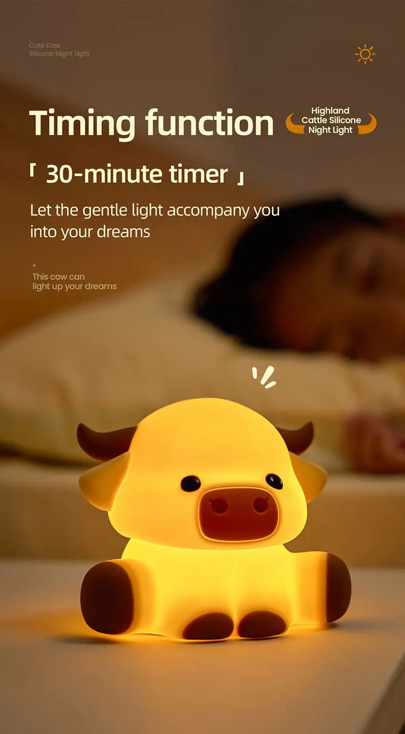 A yellow silicone cow night light lamp is shown illuminating a person's face in a dark bedroom setting.