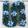 A green artificial garland shaped like the letter U decorated with blue flowers and blue berries without light.