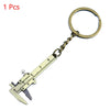 A brass metal jewelry measuring ruler and caliper keychain with a loop and a knife-like tip.