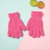 Pair of bright pink plush full finger winter gloves lying on a light blue and pink background.