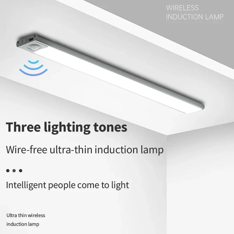 A white wireless induction lamp is installed under a cabinet, illuminating the area.