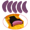 A set of purple, curved sharpening tools for a portable chainsaw tooth sharpening kit.