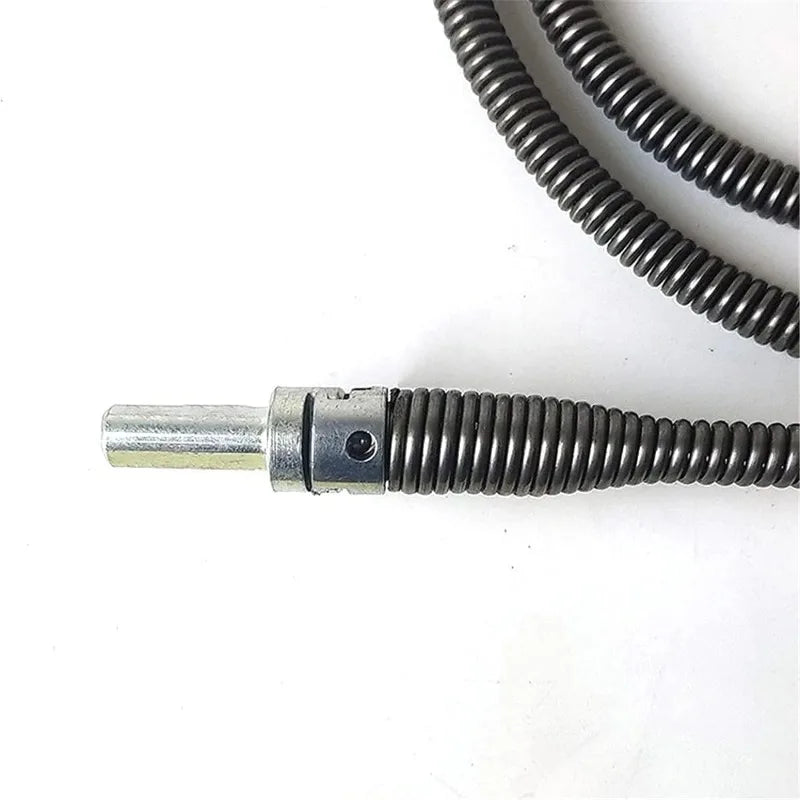 A silver spring-loaded drain cleaning tool with a drill adapter and a coiled black wire.
