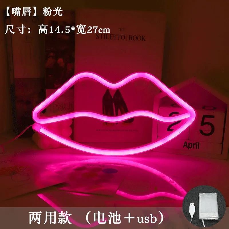 A pink neon heart lip light decoration is displayed on a surface, with a box showing the month April.
