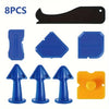 An 8 piece precision caulking tool set featuring black, blue, and yellow silicone tools.