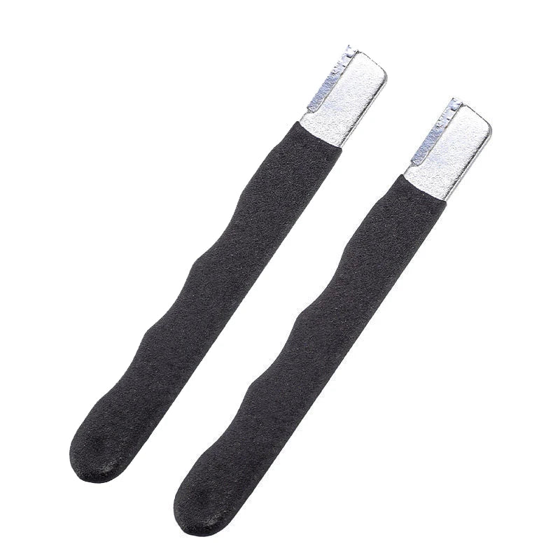 A pair of black knife and shears sharpening stones with silver metal tips.