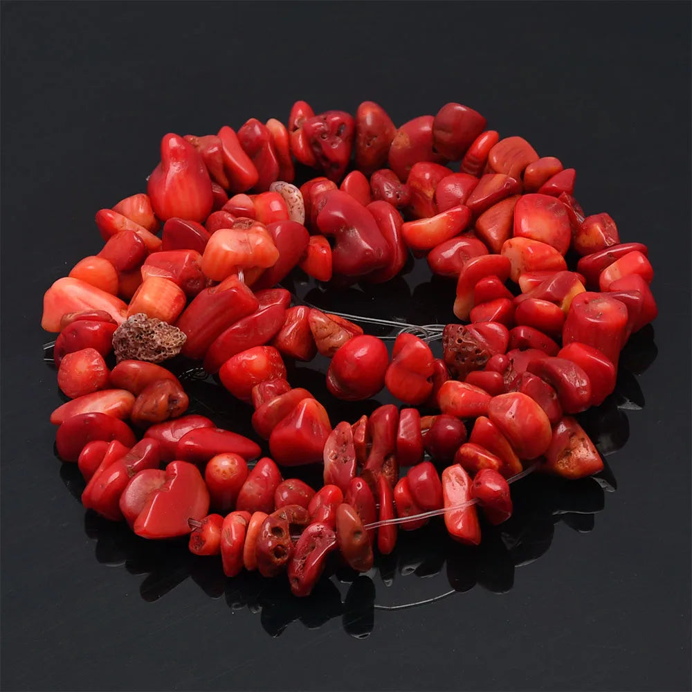 A strand of polished, reddish-pink natural stone agate beads used for DIY jewelry making.