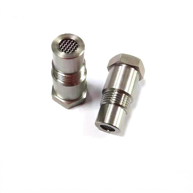 A silver precision oxygen sensor adapter for automotive, shown in a close-up view.