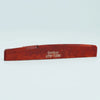 A wooden guitar bone bridge saddle with the name Guyker ATR-7230 engraved on it.