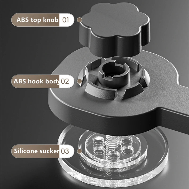 Close-up view of a black adhesive towel rack featuring ABS components and a silicone suction base.