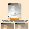 A white folding clip book light with an adjustable LED is shown in various lighting scenarios.