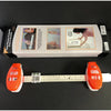 A box containing a precision picture hanging level and angle measuring tool with an orange plastic device.