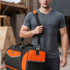 A man holds an orange and black tool bag in a construction setting.