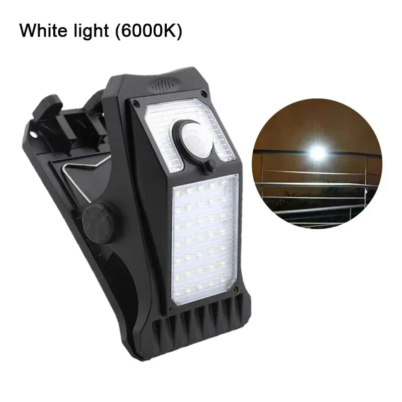 A black solar LED clip-on motion sensing outdoor light with a white light (6000K) bulb.