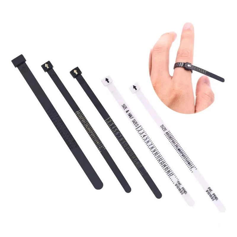 A hand is shown holding a black plastic ring sizer tool with measurement markings.