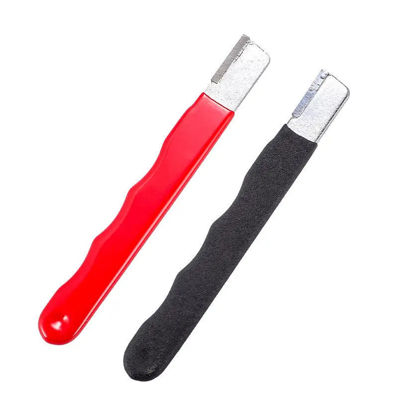 A red and black multi-purpose knife and shears sharpening stone with silver metal blades.