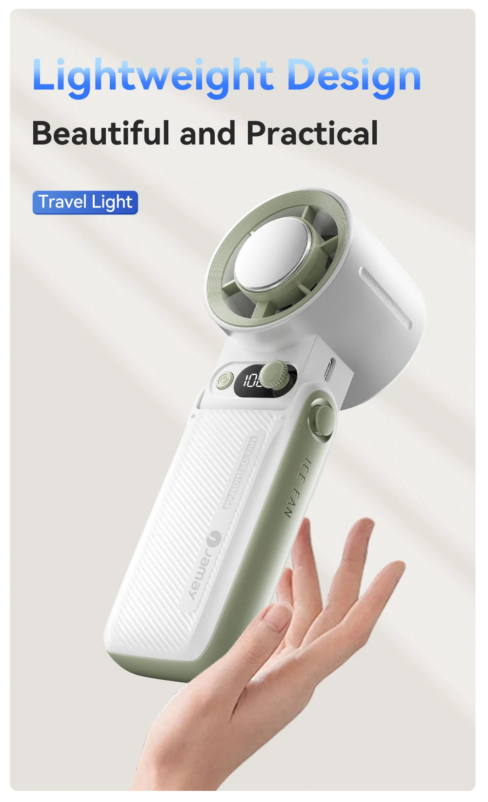 A hand is holding a white and light green portable handheld fan with a digital display.