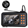 A black handheld industrial inspection camera with a lens and cable, showing an internal view.