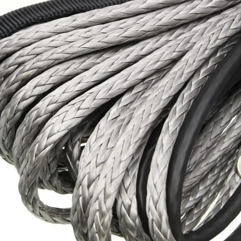 Close-up of a heavy-duty synthetic tow strap made of braided gray and black material.