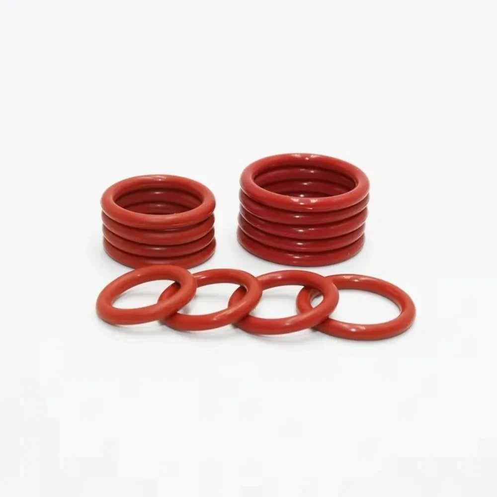 A set of multi-size silicone O-rings in a reddish-orange color, arranged in stacks.