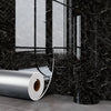 Roll of silver marble wall decals against a black marble background.