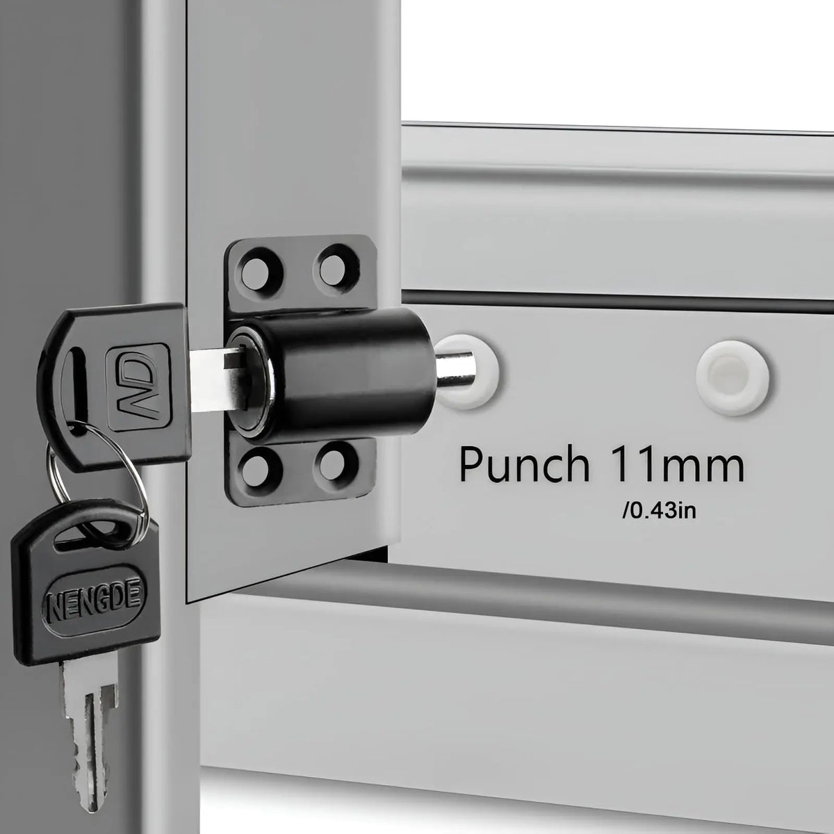 A close-up view of a silver door lock mechanism with a punch and key visible.