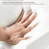 A hand is resting on a white, high-elastic sponge cushion used as a car armrest or seat component.