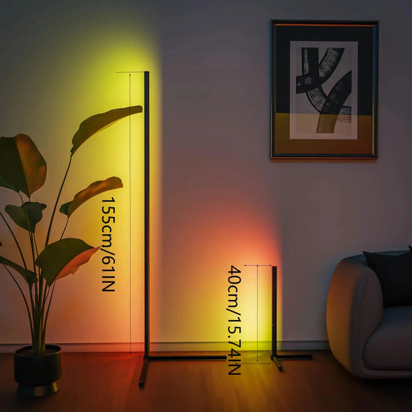 A modern floor lamp with adjustable RGB LED lighting illuminates a room, casting colorful light onto the wall.