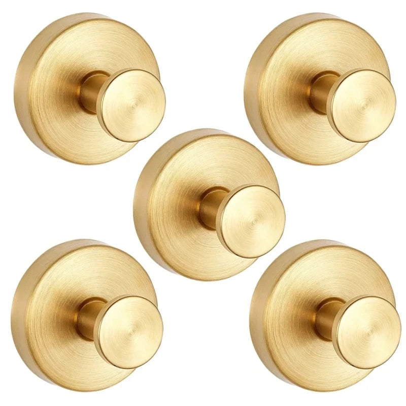 A set of heavy duty stainless steel suction cup shower hooks in a brushed gold finish.