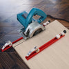 A blue precision adjustable circular saw guide rail mounted on a light wood surface.