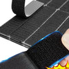 Black hook and loop carpet fixing tape with a double-sided hook and adhesive patch being applied to a surface.