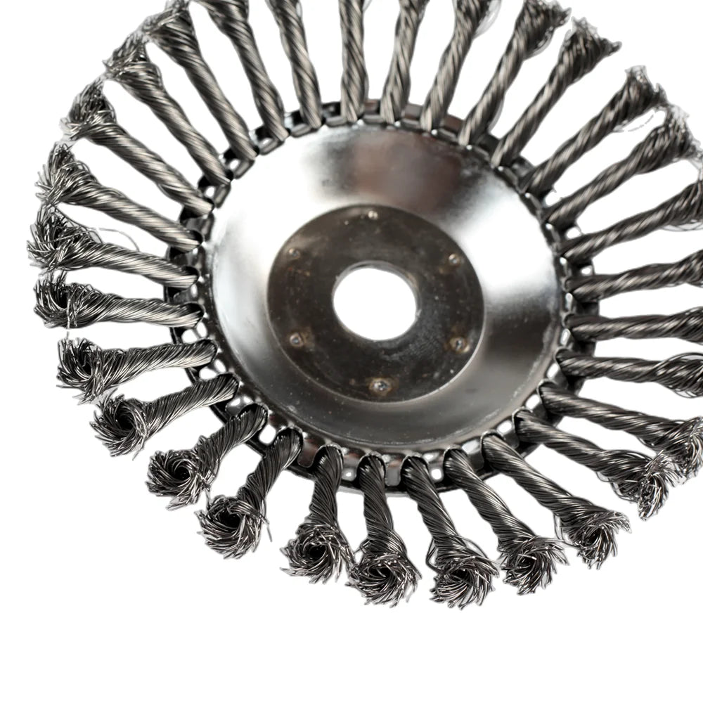 Close-up view of a universal gas or petrol trimmer head with numerous rotating wire cutting elements.
