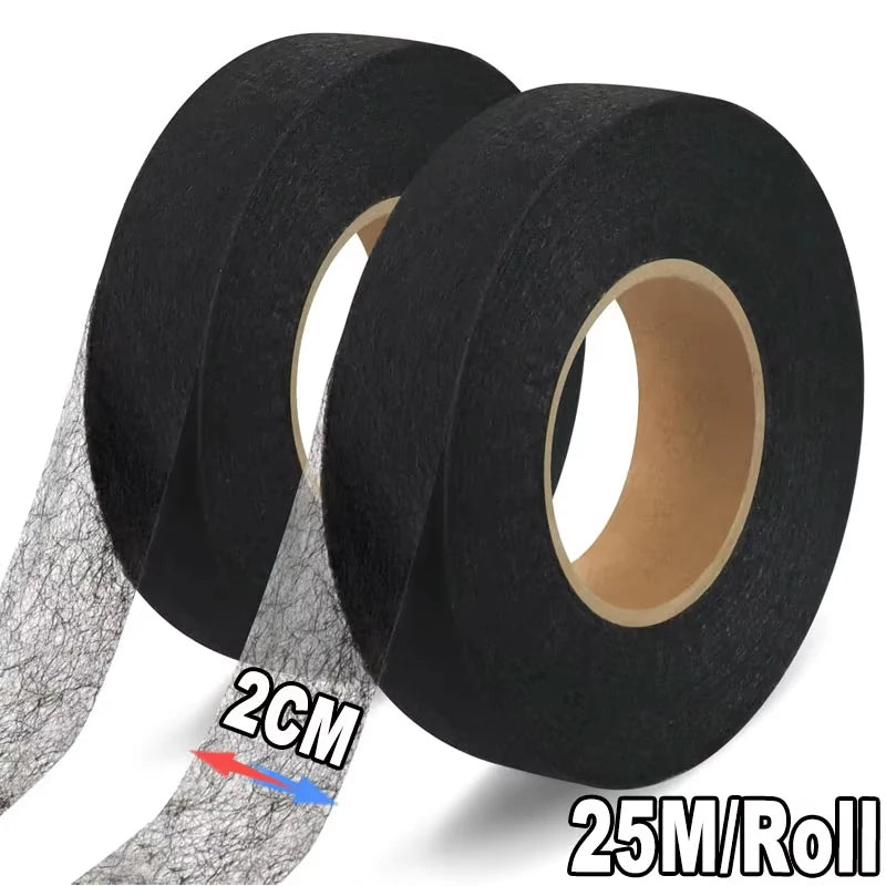 Roll of 25 meters of black iron-on hemming tape for fabric edging.