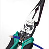 A close-up of a green and black wire stripping tool gripping a blue wire, demonstrating quick wire stripping.