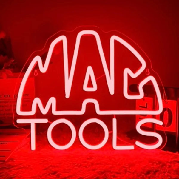 A bright red neon sign spelling out MAP TOOLS is illuminated against a dark background.