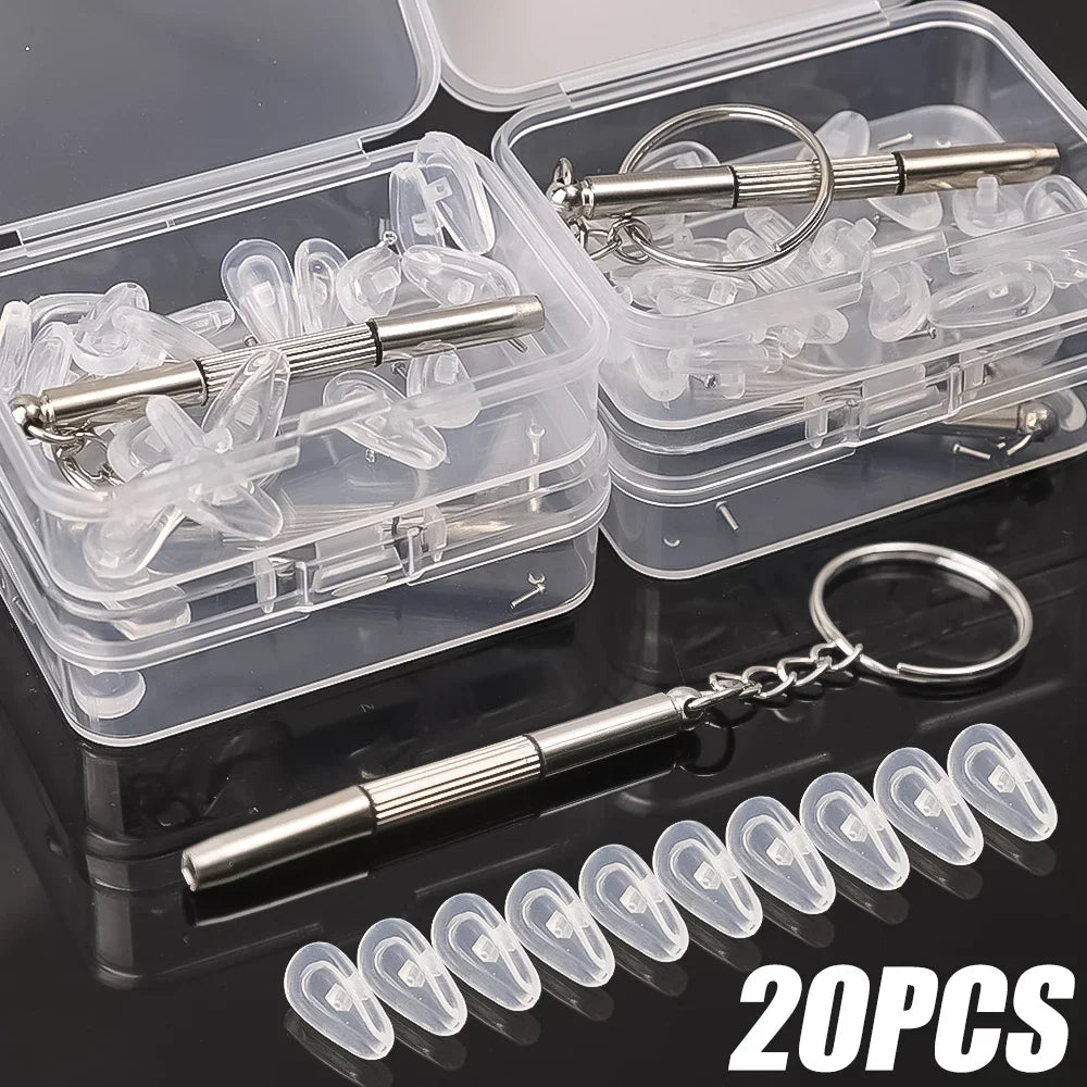 A set of adjustable silicone eyeglass nose pads with screwdrivers packaged in clear plastic containers.