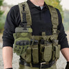 A person wearing a dark shirt is shown with olive green parachute rope work gloves attached to a tactical vest.
