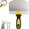 A yellow and black putty knife scraper tool is shown next to a white block and a small container.