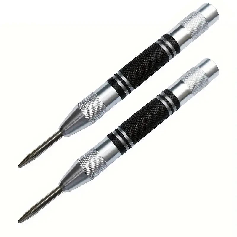 A close-up view of a heavy duty automatic center punch tool with a silver and black handle.